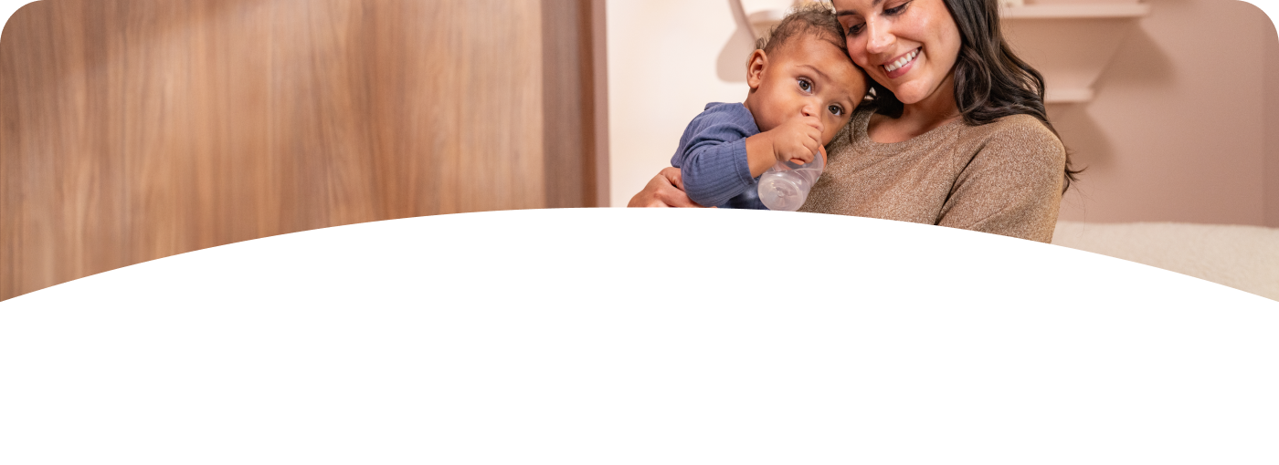 Mother and Baby with Learner Bottle