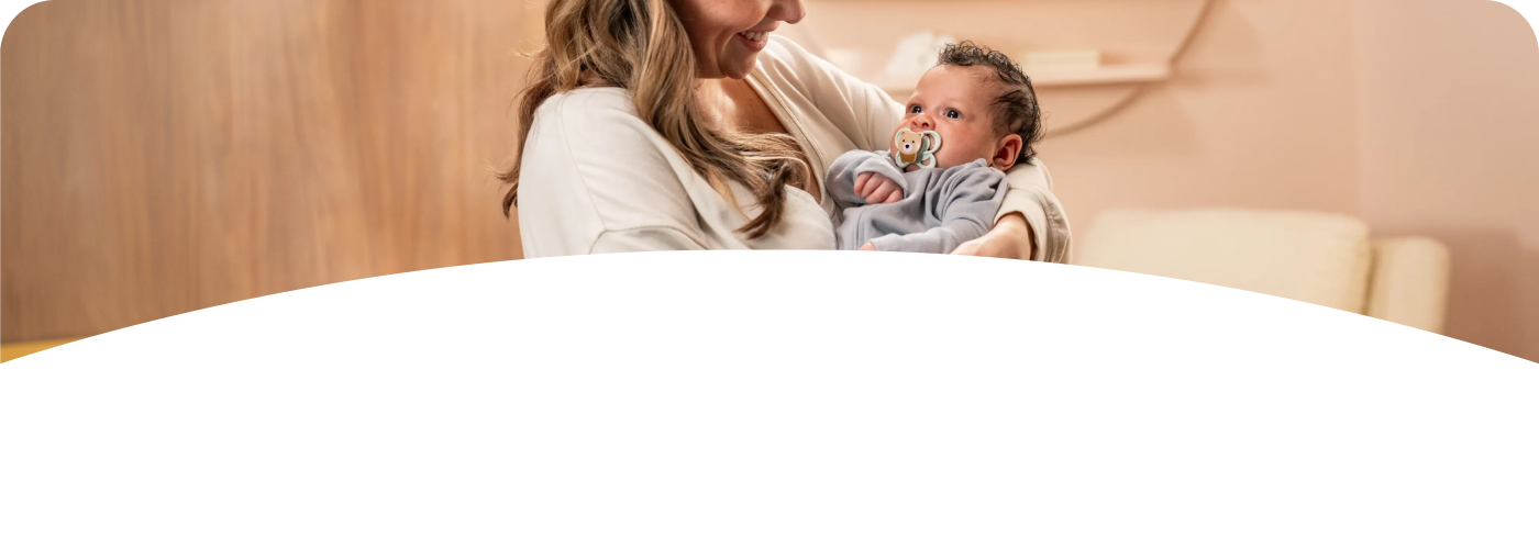 Mother with baby and soother