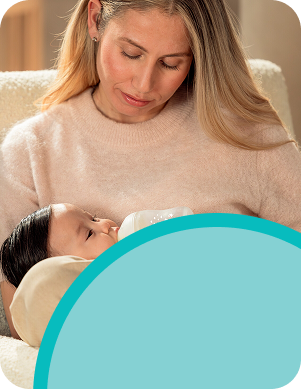 Mother with baby and baby bottle