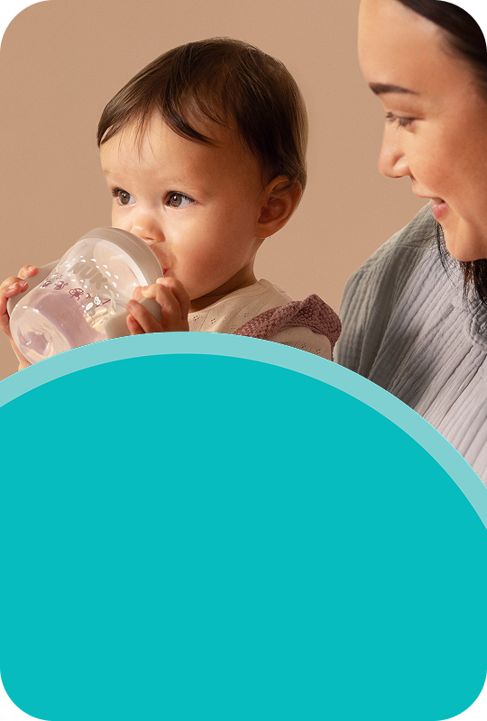 Mother with Baby and Learner bottle