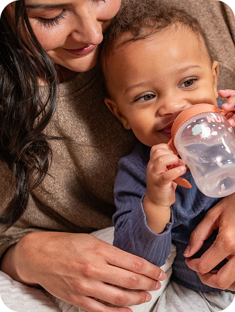Mother with baby and Learner bottle