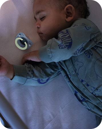 Baby sleeping with soother